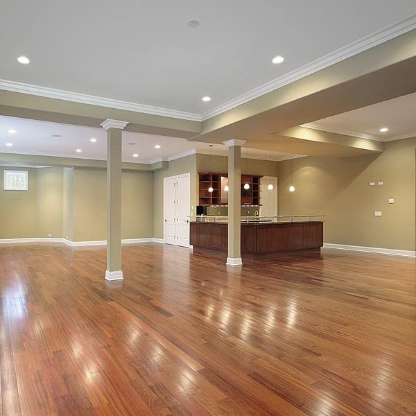 hardwood flooring can be installed in a basement or a room with a concrete subfloor with proper preparation